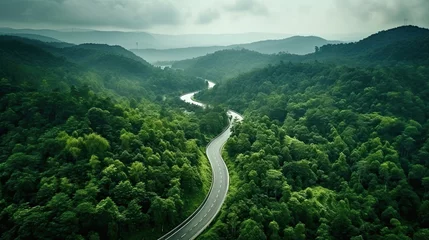 Foto auf Acrylglas Antireflex Aerial top view beautiful curve road on green forest in the rain season. © Oulaphone