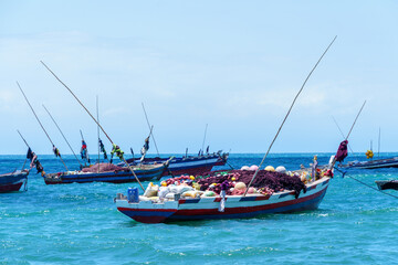 traditional dhow fishing boats moored at high tide