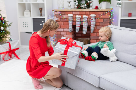 Mom Presents Christmas Gift To Her Little Son