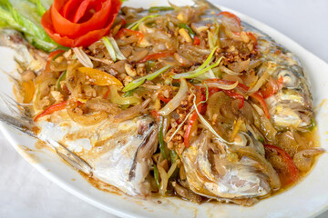 steamed pompano or kuwe fish with sweet and spicy sauce