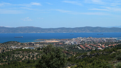 Fototapeta na wymiar View of the city of Lavrion and the island of Makronisos in East Attica near Athens. Lavrion was a mining center during antiquity while in Makronisos political prisoners mainly communists where exiled