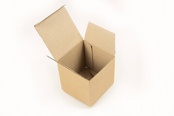 Opened small paper box made of corrugated cardboard, top view, visible bottom, place for goods, gifts