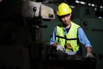 factory worker using tape measure and measuring spare parts in the factory