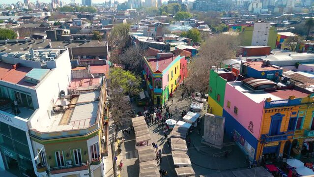 Aerial view of Caminito a famous landmark in La Boca neighborhood in Buenos Aires, Argentina. Drone flying forward
