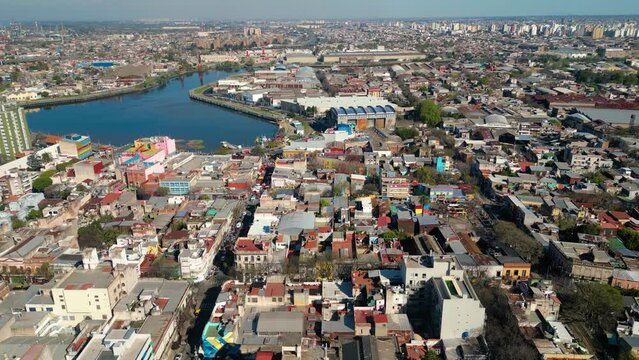 Aerial view of Caminito a famous landmark in La Boca neighborhood in Buenos Aires, Argentina. Drone flying forward
