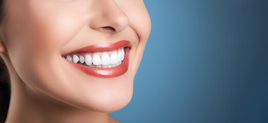 Close - up cropped of a beautiful smiling  woman with white perfect teeth isolated on blue studio background with copy space. Dental care. Stomatology. Dentistry concept. banner