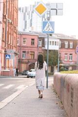 Fototapeta na wymiar girl walks the streets of Kharkiv