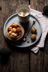 Homemade Russian Walnut Cookies with boiled condensed milk, Oreshki top view. Christmas card