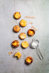 pasteis de nata Portugal sweet pastry on grey background top view. trendy dessert recipes. cook book food photo.