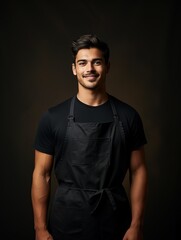 Mockup of chef or waiter, baker, worker in blank black apron isolated on dark background