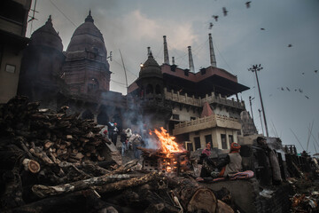 Manikarnika Ghat, the sacred cremation ground of Varanasi, where life and death merge into a divine...