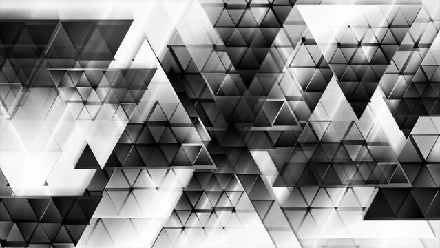 Black white glossy triangles abstract technology background. Seamless looping geometric low poly motion design. Video animation Ultra HD 4K 3840x2160