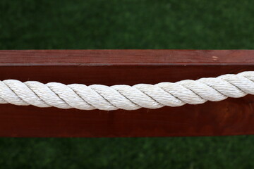 Thick hemp rope on the pier in the seaport.