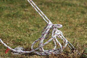 Thick hemp rope on the pier in the seaport.