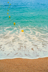 Fototapeta na wymiar Beach buoys for safe swimming of people