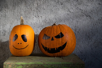 scary funny Halloween pumpkins on wooden table
