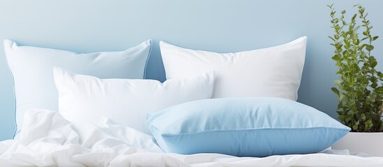 Blue pillows on white bedding With copyspace for text