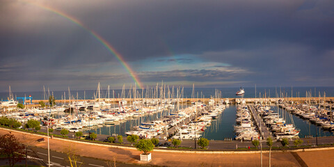 Panoramic view of Old Port Of Menton witn rainbow, French Riviera, France