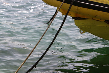 Thick hemp rope on the pier in the seaport.
