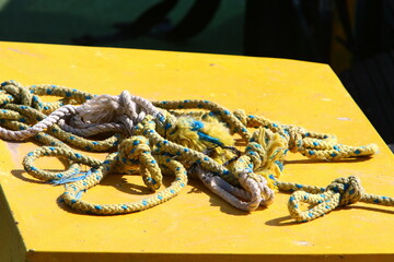 Thick hemp rope on the pier in the seaport.