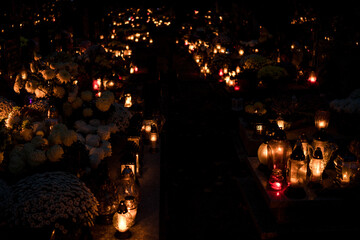 Cemetery paths at night filled with candlelit from grave candles, wide shot — Poland, November 1,...