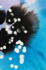 Rolgordijnen Black and white Ink watercolor flow blot on blue texture paper background. © Liliia
