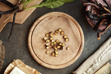 Sliced comfrey root on a wooden cutting board, top view