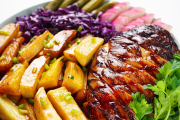 Grilled steak with fries and salad, set dish in a restaurant