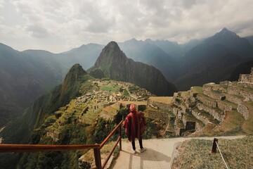 landscape in machupicchu peru with peruvian man in poncho - obrazy, fototapety, plakaty