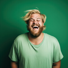 Obraz premium Face of happy overweight man looking at camera on green studio background, chromakey