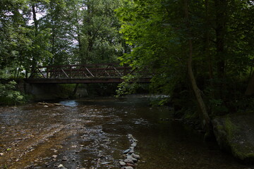 Fototapeta na wymiar Bridge over the river Zdobnice in Slatina nad Zdobnici, Hradec Králové Region, Czech Republic, Europe 