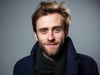 Fototapeta premium Happy european man in casual clothing against a neutral background
