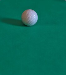 golf ball on green background