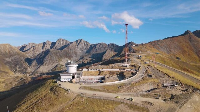 Aerial drone view of an old radio tower on top of a mountain in Andorra