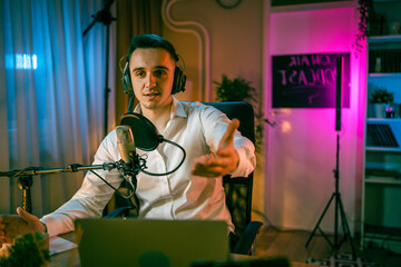 man shooting or streaming video podcast or vlogg blogger at studio