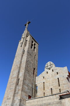 Stone tower with the cross of the Santuario da Penha in Guimaraes, Portugal. Vertical image.