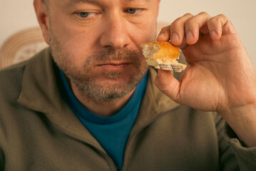 43 year old man eats bread