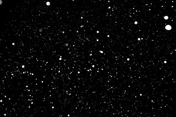 Background snowfall on a black background. Isolate. 