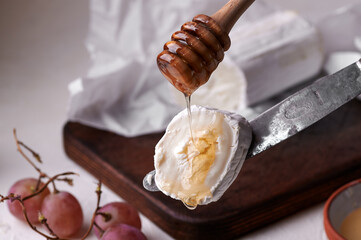 Close up of soft goat cheese with honey