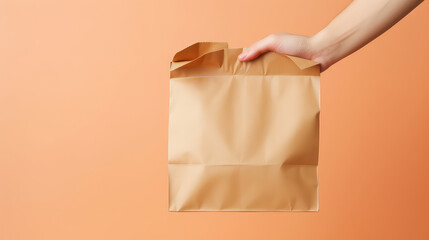 Closeup of paper bag with ready to eat food in hands of courier. Package template for takeaway food, fast food delivery and restaurant meals.  - obrazy, fototapety, plakaty