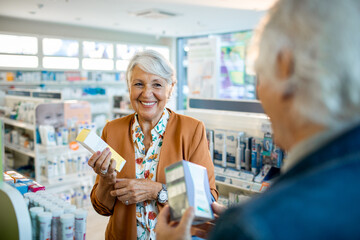 Senior couple buying medication at a pharmacy