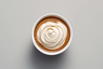 Foto op Plexiglas top down view of cream in a single coffee cup © Castle Studio