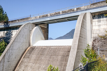 Large concrete dam with spill way and parapet wall. Supplies fresh water to metro Vancouver region....