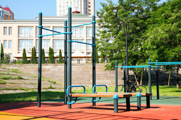 Empty outdoor gym with exercise equipment in park