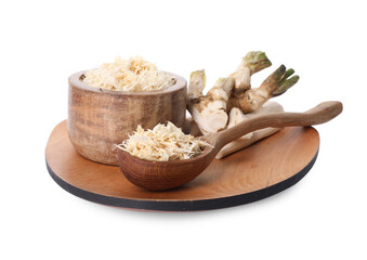 Board with grated horseradish, cut roots and spoon isolated on white