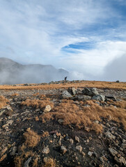 Man hiking to the summit of Mount Washington in New Hampshire 