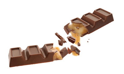 Broken chocolate bar with yummy caramel in air on white background