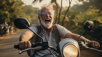 A Happy elderly man enjoying a road trip, adventure driving a motorbike on a road covered with tall trees.