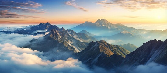 Panoramic sunset above clouds on mountain peak With copyspace for text