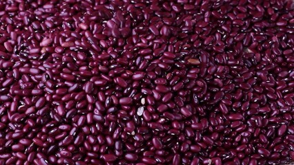 raw red kidney bean seed grains placed on bean background. Top view